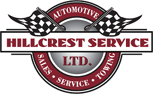 A circular logo with two checkered black and white flags for Hillcrest Service.